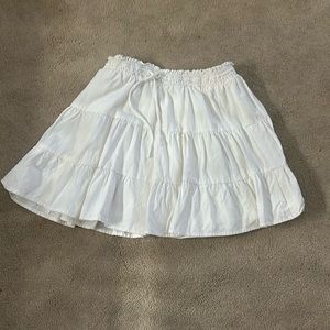 White flowy mini skirt